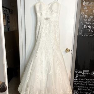 Wedding dress used once. Vail included . No rips or tears or stains.
